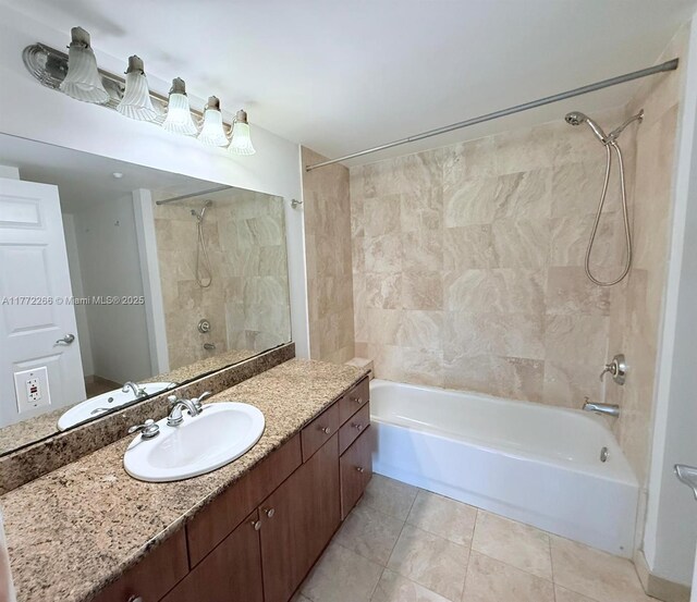 201 Golden Isles Dr Unit 311, Hallandale Beach, FL 33009 - bathroom featuring shower / bath combination, vanity, and tile patterned flooring