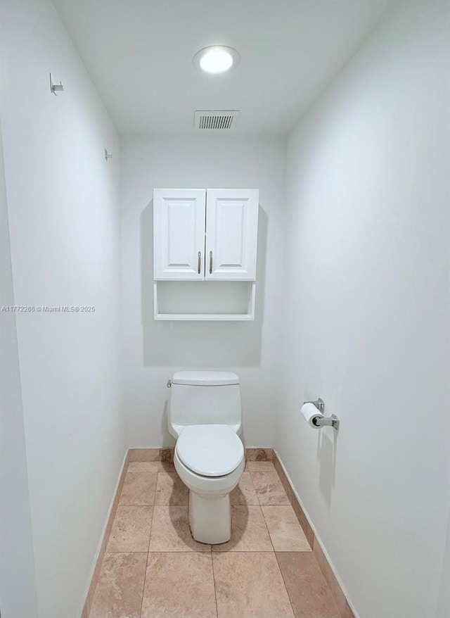 201 Golden Isles Dr Unit 311, Hallandale Beach, FL 33009 - bathroom featuring toilet and baseboards