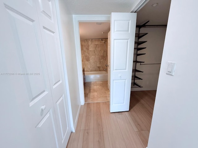 201 Golden Isles Dr Unit 311, Hallandale Beach, FL 33009 - corridor featuring light wood-type flooring