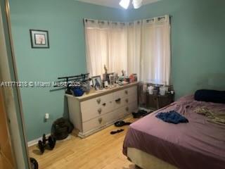 11041 SW 166th Ter, Miami, FL 33157 - bedroom featuring light wood-style floors
