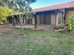 11041 SW 166th Ter, Miami, FL 33157 - exterior space with a yard