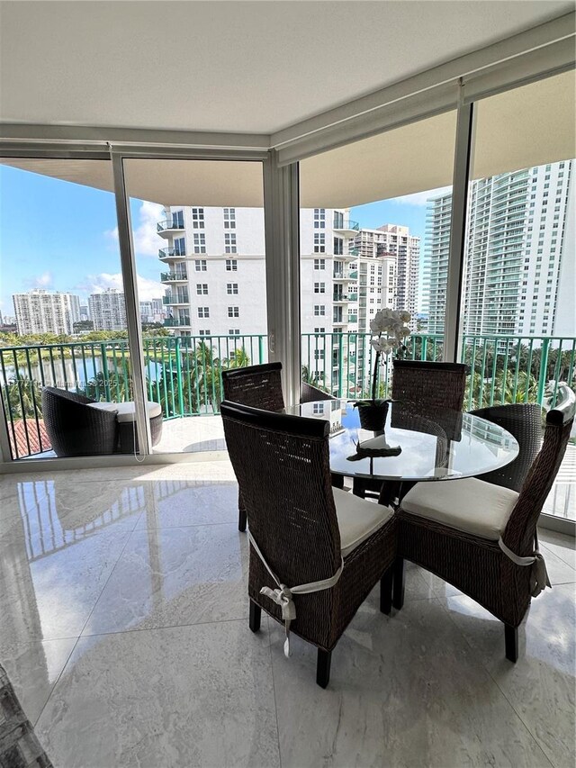 19900 E Country Club Dr Unit 1012, Aventura, FL 33180 - dining area featuring floor to ceiling windows, marble finish floor, and a city view