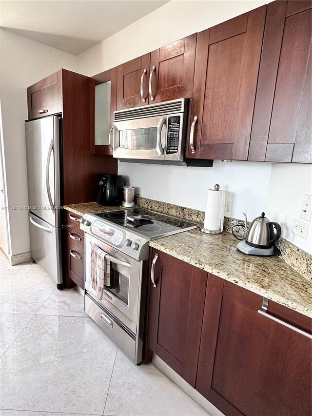 19900 E Country Club Dr Unit 1012, Aventura, FL 33180 - kitchen with light stone counters and stainless steel appliances