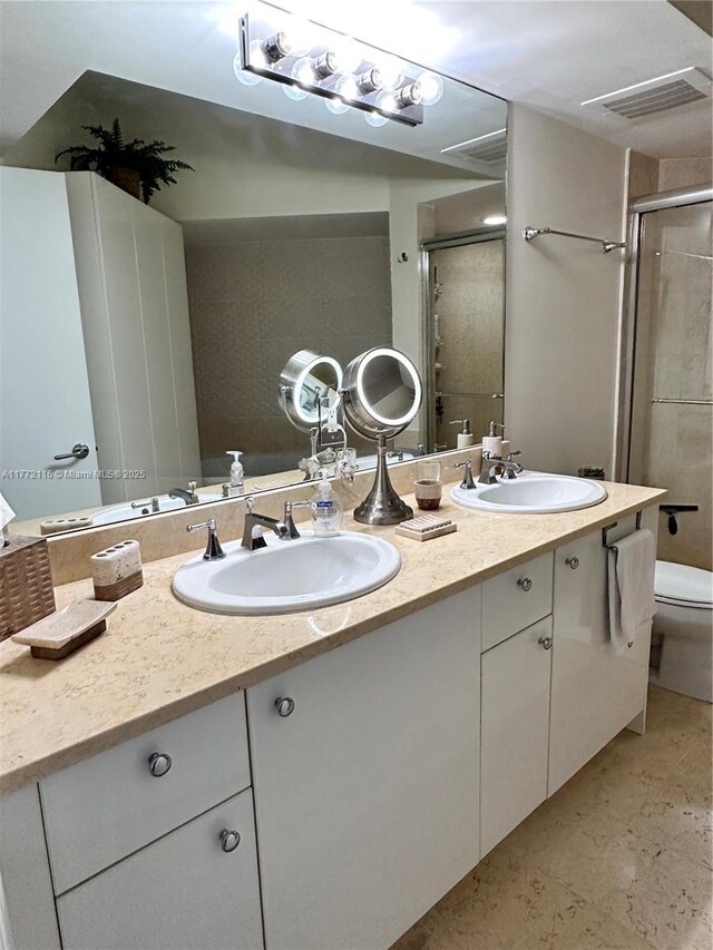 19900 E Country Club Dr Unit 1012, Aventura, FL 33180 - bathroom featuring toilet, a sink, double vanity, and a shower stall