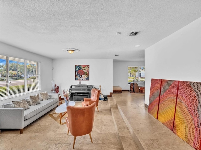 9461 SW 128th St, Miami, FL 33176 - living area featuring a textured ceiling and visible vents