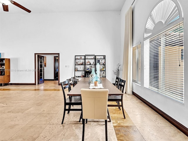 9461 SW 128th St, Miami, FL 33176 - dining area featuring a high ceiling, baseboards, and ceiling fan