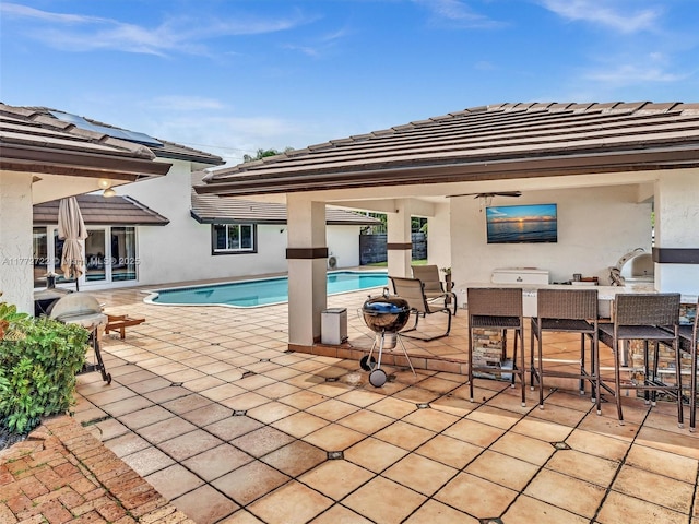 9461 SW 128th St, Miami, FL 33176 - outdoor pool with an outdoor kitchen, a patio area, and outdoor wet bar