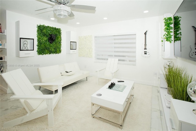 living area featuring recessed lighting, baseboards, and ceiling fan