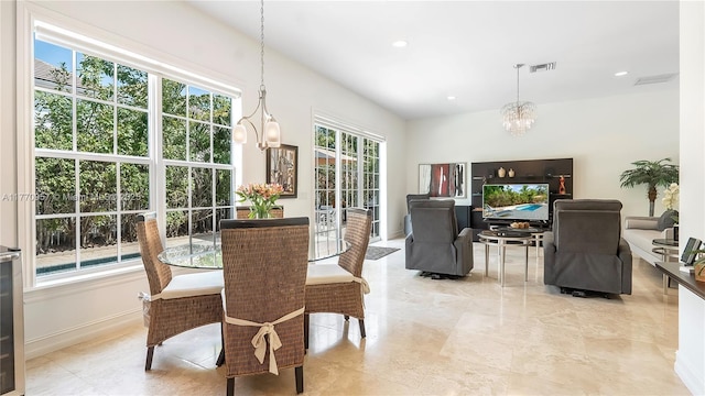 dining area with baseboards, visible vents, an inviting chandelier, and recessed lighting