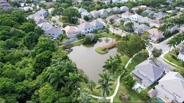 aerial view featuring a residential view and a water view