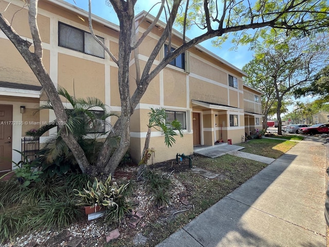 9491 N Palm Cir N Unit 9491, Pembroke Pines, FL 33025 - view of side of property featuring stucco siding