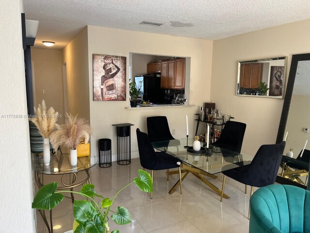 9491 N Palm Cir N Unit 9491, Pembroke Pines, FL 33025 - dining area with visible vents, a textured ceiling, and light tile patterned floors