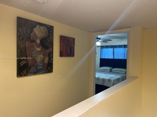 9491 N Palm Cir N Unit 9491, Pembroke Pines, FL 33025 - hallway featuring a textured ceiling