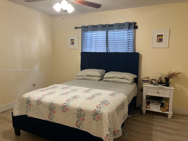 9491 N Palm Cir N Unit 9491, Pembroke Pines, FL 33025 - bedroom featuring baseboards, ceiling fan, and wood finished floors