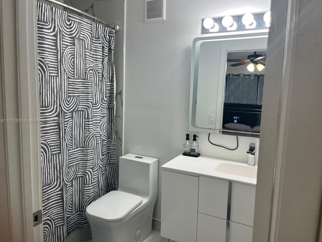 9491 N Palm Cir N Unit 9491, Pembroke Pines, FL 33025 - bathroom with ceiling fan, vanity, toilet, a shower with shower curtain, and visible vents