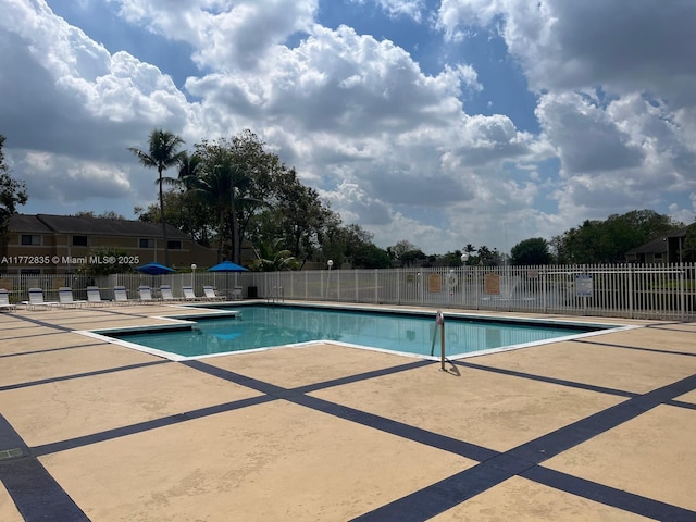 9491 N Palm Cir N Unit 9491, Pembroke Pines, FL 33025 - community pool with fence and a patio area