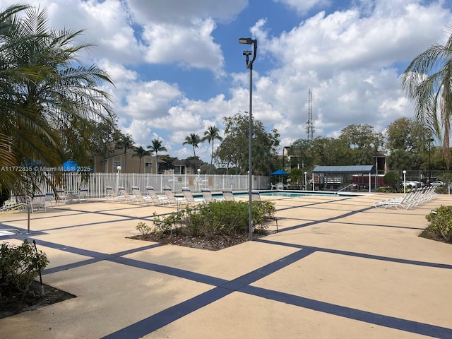 9491 N Palm Cir N Unit 9491, Pembroke Pines, FL 33025 - exterior space with a patio, a swimming pool, and fence