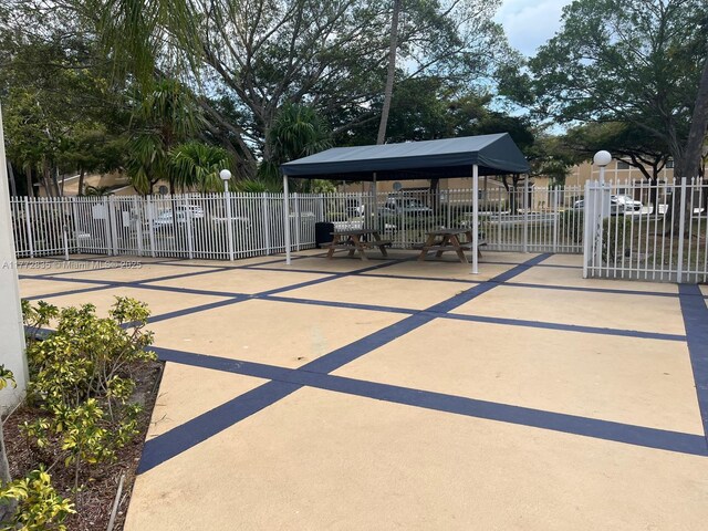 9491 N Palm Cir N Unit 9491, Pembroke Pines, FL 33025 - view of home's community featuring fence and a gazebo