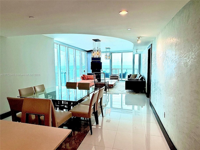 17001 Collins Ave Unit 2508, Sunny Isles Beach, FL 33160 - dining room with a chandelier and floor to ceiling windows