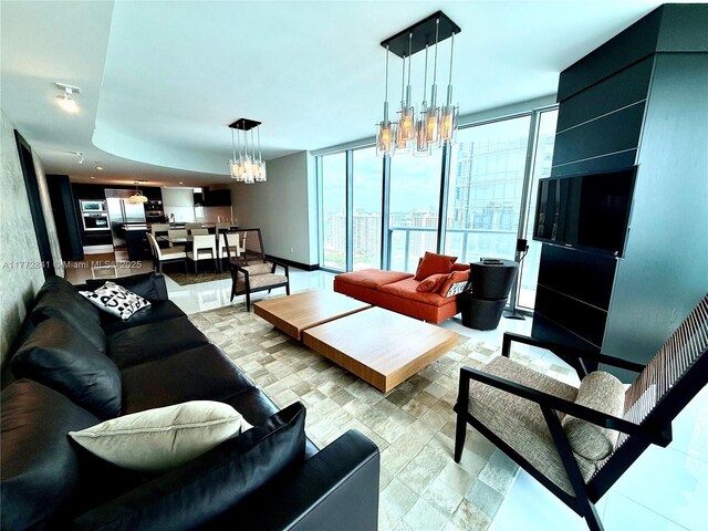 17001 Collins Ave Unit 2508, Sunny Isles Beach, FL 33160 - kitchen featuring a sink, built in appliances, a kitchen island, a peninsula, and light countertops