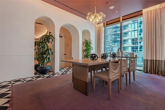 office featuring a notable chandelier and arched walkways