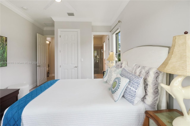 bedroom with visible vents and ornamental molding