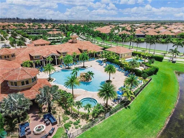 drone / aerial view with a residential view and a water view