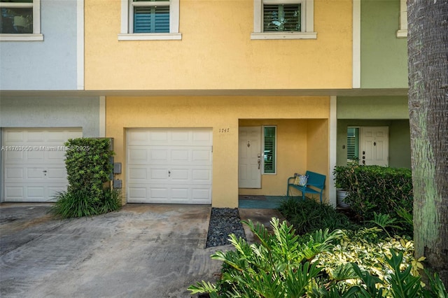 1747 NE 4th Ave Unit F2, Fort Lauderdale, FL 33305 - townhome / multi-family property featuring an attached garage and stucco siding