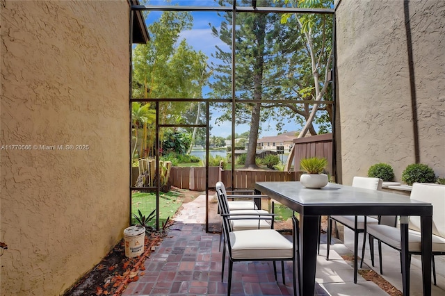 2030 Bayberry Dr Unit 2030, Pembroke Pines, FL 33024 - view of patio / terrace featuring outdoor dining area, fence, and a water view