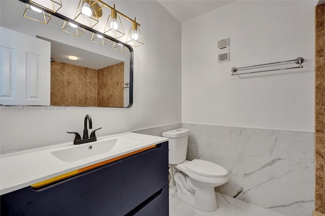 2030 Bayberry Dr Unit 2030, Pembroke Pines, FL 33024 - bathroom with tile walls, toilet, vanity, wainscoting, and marble finish floors
