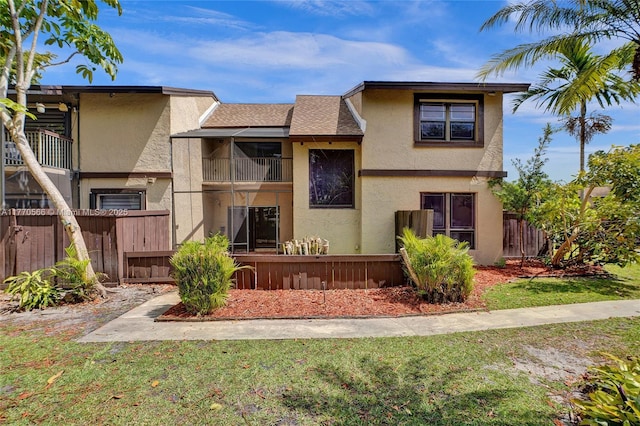 2030 Bayberry Dr Unit 2030, Pembroke Pines, FL 33024 - view of front of home with stucco siding, a balcony, and a shingled roof