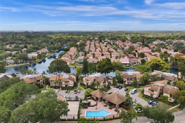 2030 Bayberry Dr Unit 2030, Pembroke Pines, FL 33024 - aerial view of property and surrounding area featuring nearby suburban area, a large body of water, and a pool area