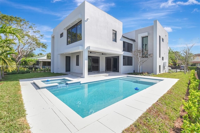 1419 N Lakeside Dr, Lake Worth, FL 33460 - back of property with a ceiling fan, stucco siding, a pool with connected hot tub, and a patio area
