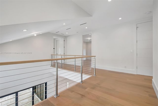 1419 N Lakeside Dr, Lake Worth, FL 33460 - hallway with an upstairs landing, wood finished floors, recessed lighting, baseboards, and vaulted ceiling