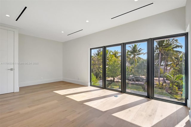 1419 N Lakeside Dr, Lake Worth, FL 33460 - spare room featuring light wood finished floors, healthy amount of natural light, baseboards, and recessed lighting