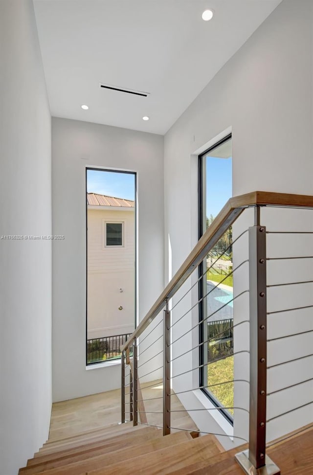1419 N Lakeside Dr, Lake Worth, FL 33460 - stairway featuring wood finished floors, healthy amount of natural light, and recessed lighting