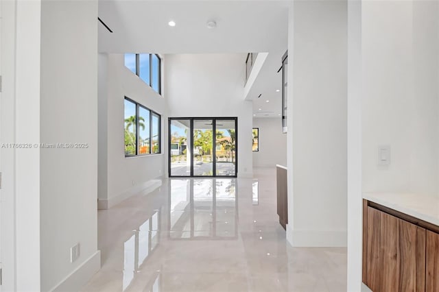 1419 N Lakeside Dr, Lake Worth, FL 33460 - hallway with baseboards, a high ceiling, and recessed lighting