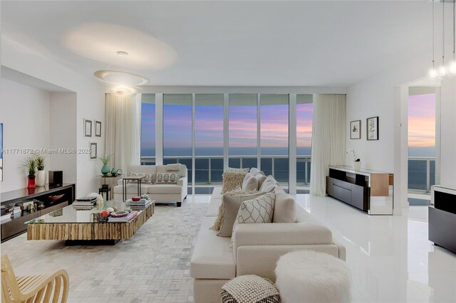 15811 Collins Ave Unit 2101, Sunny Isles Beach, FL 33160 - living area featuring expansive windows, healthy amount of natural light, and a water view