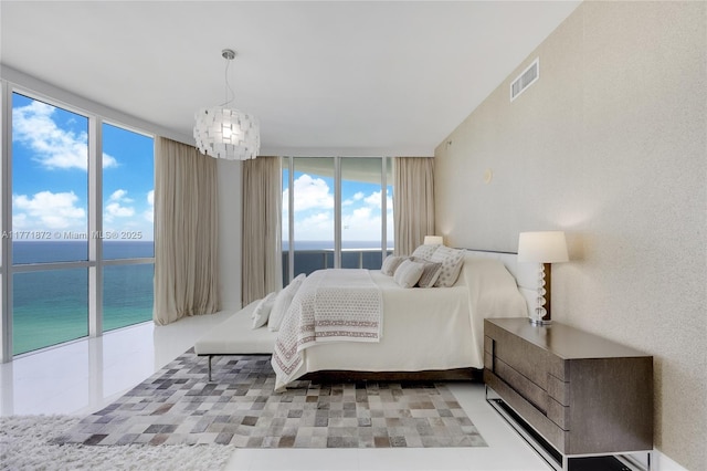 15811 Collins Ave Unit 2101, Sunny Isles Beach, FL 33160 - bedroom featuring a water view and a wall of windows