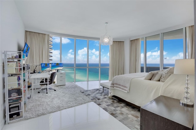 15811 Collins Ave Unit 2101, Sunny Isles Beach, FL 33160 - bedroom featuring a wall of windows, multiple windows, access to exterior, an office area, and tile patterned floors
