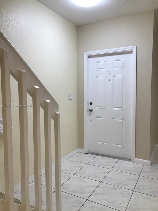 foyer entrance with baseboards
