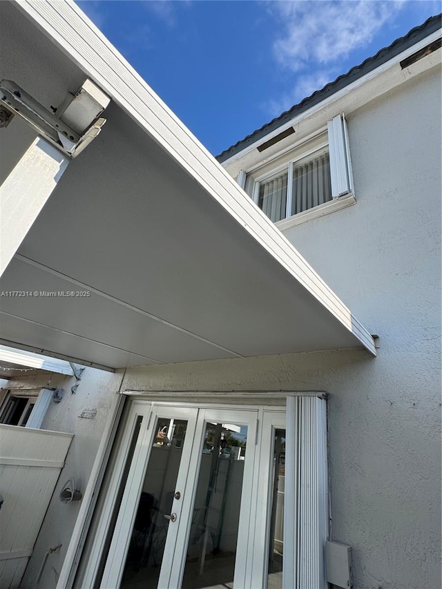 130 SW 109th Ave Unit 7, Sweetwater, FL 33174 - exterior view of french doors and stucco siding