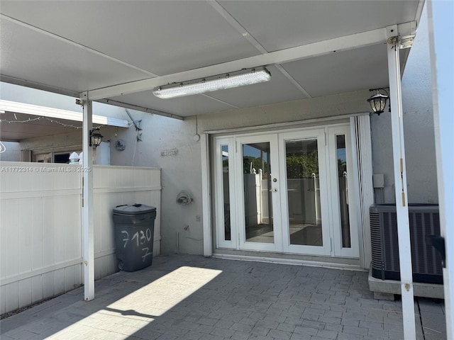 130 SW 109th Ave Unit 7, Sweetwater, FL 33174 - view of patio with french doors, central AC, and fence