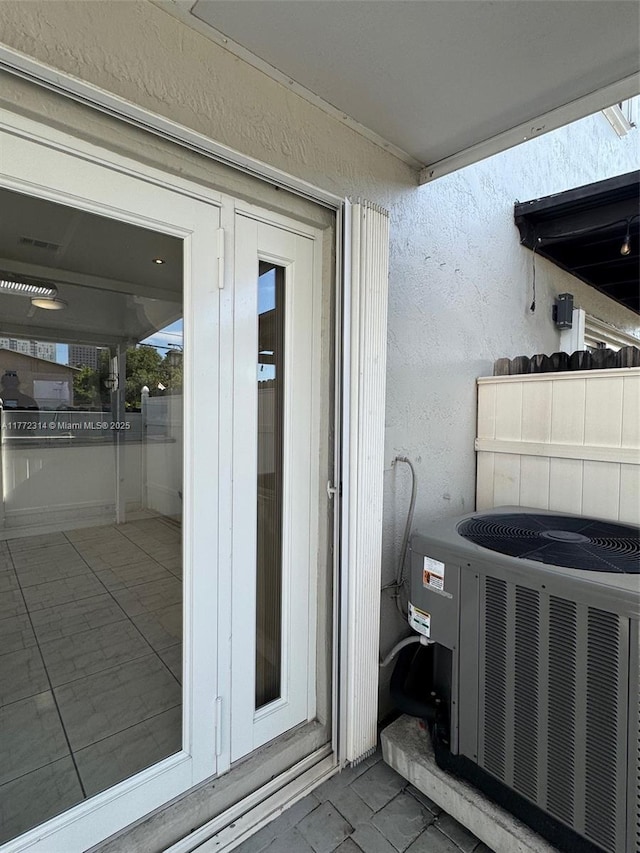 130 SW 109th Ave Unit 7, Sweetwater, FL 33174 - doorway to property featuring cooling unit and stucco siding