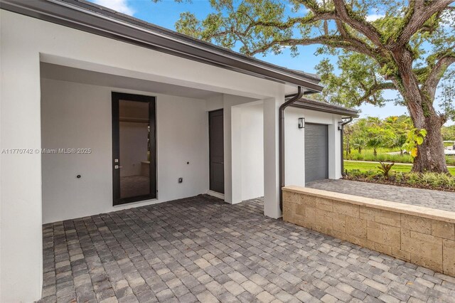 7285 SW 72nd Ter, Miami, FL 33143 - view of patio featuring a garage