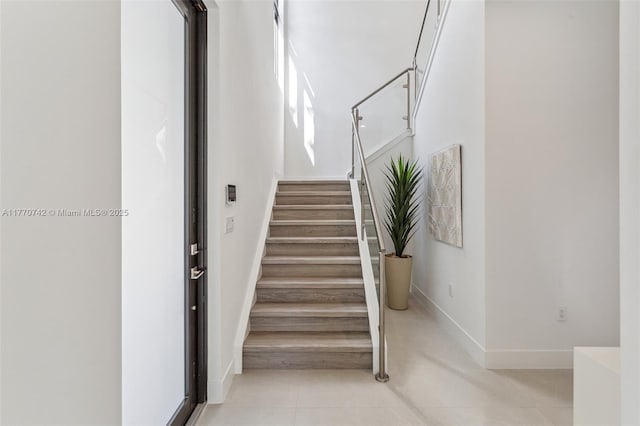 7285 SW 72nd Ter, Miami, FL 33143 - stairway featuring tile patterned floors and baseboards