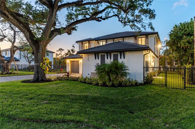 7285 SW 72nd Ter, Miami, FL 33143 - view of front of property with a garage and stucco siding