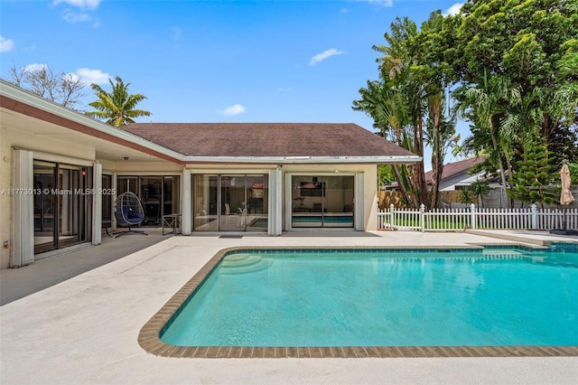 view of pool with a patio, a fenced in pool, and fence