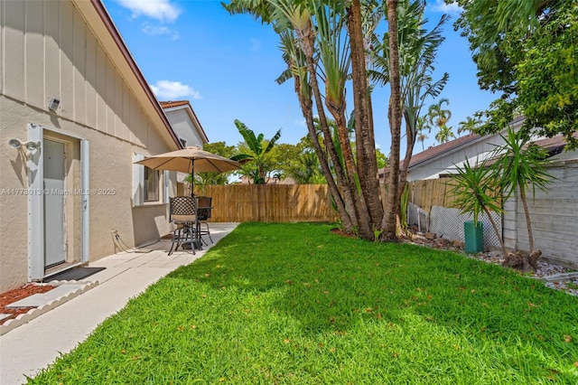 view of yard featuring a fenced backyard and a patio area