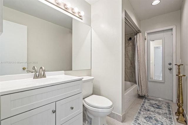 bathroom featuring vanity, toilet, and shower / bath combination with curtain